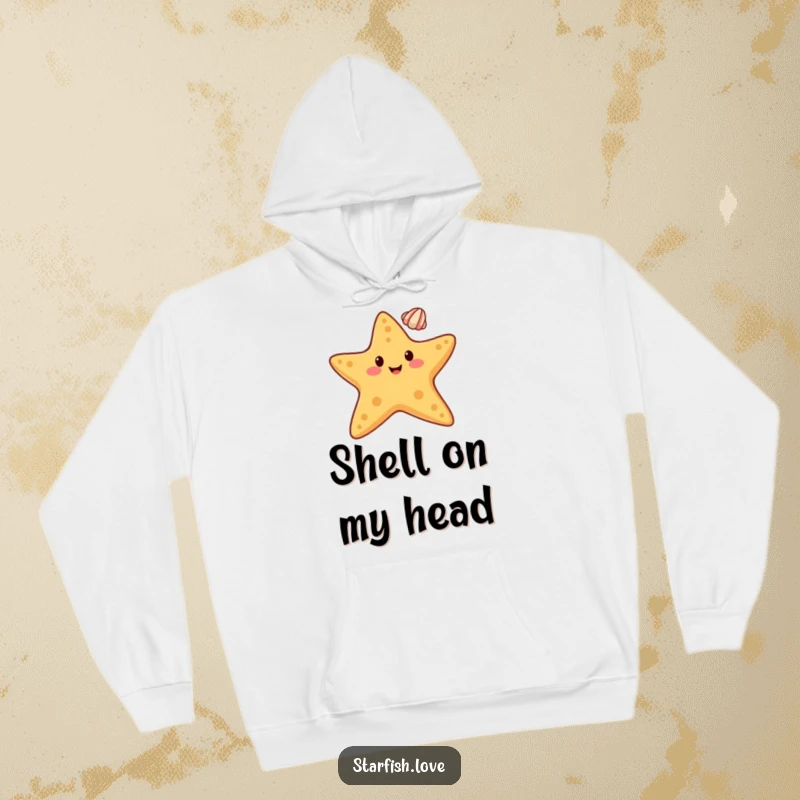 Funny hoodie with a happy starfish character balancing a small seashell on its tip, representing perfect equilibrium.
